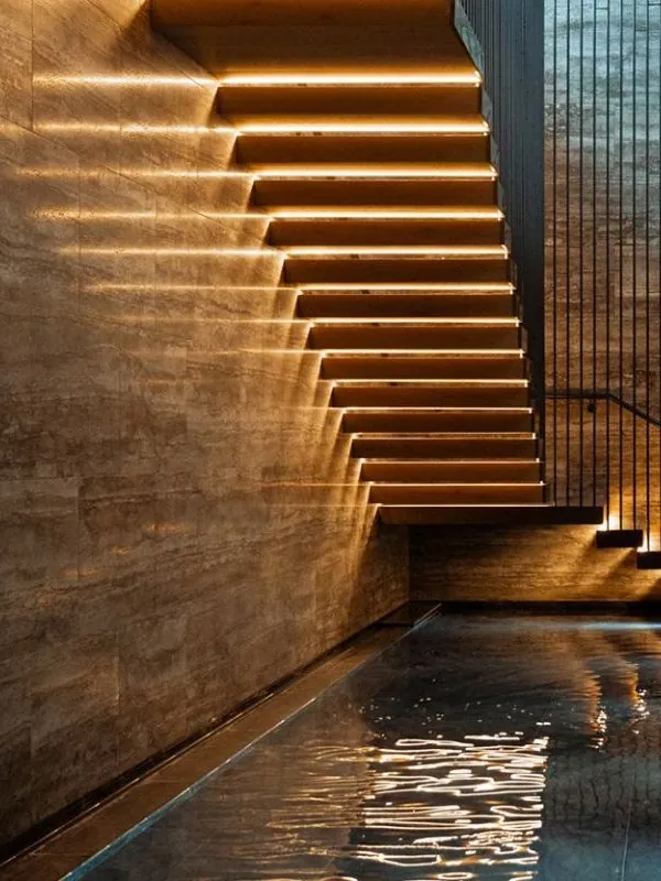 Split-level townhouse interior with floating staircase